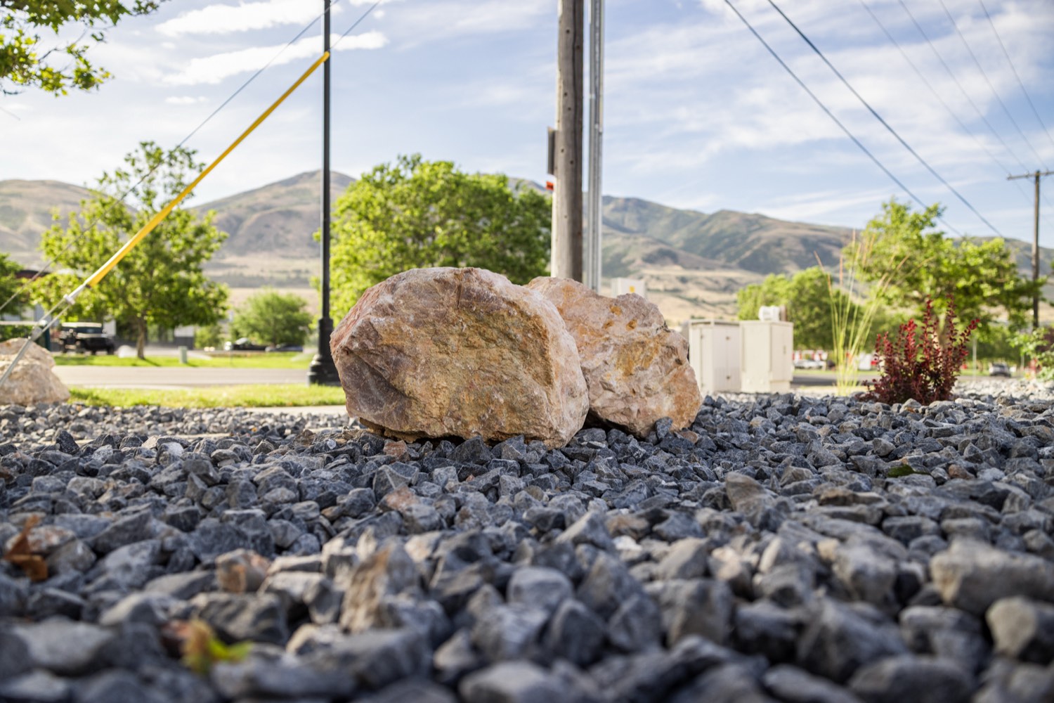Boulder and rock feature with mountain backdrop
